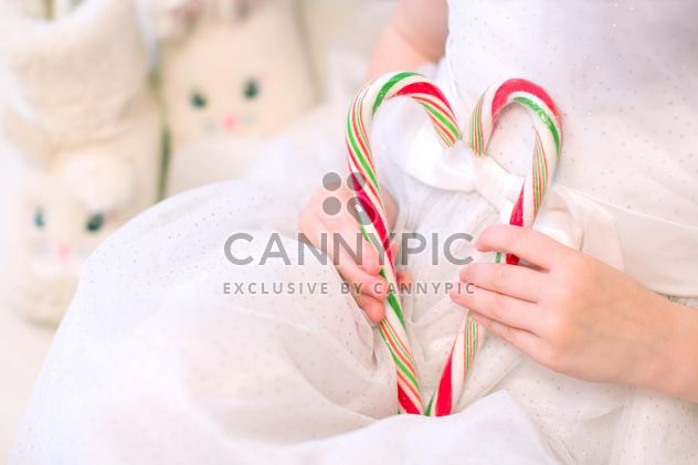 Candies in small girl's hands - Free image #182559