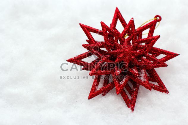Red Christmas toy in snow - Free image #182599