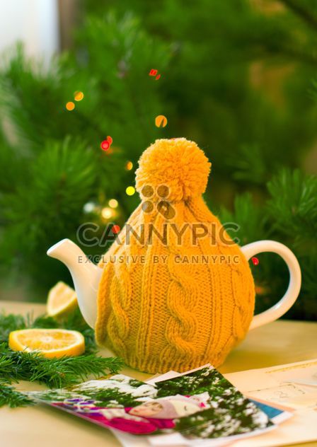 Teapot in knitted hat - image #182619 gratis