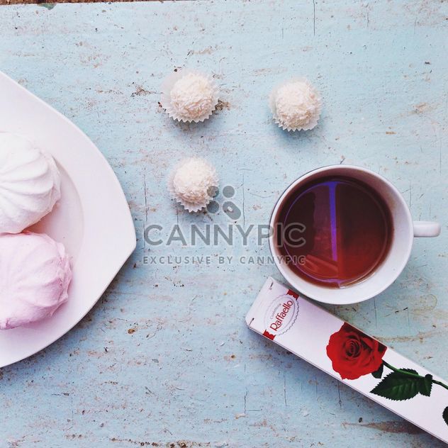Candies, zephyr and cup of tea - image gratuit #198419 