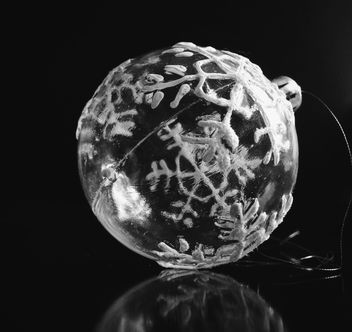 Transparent Christmas ball with snowflakes on a black background. - бесплатный image #198809