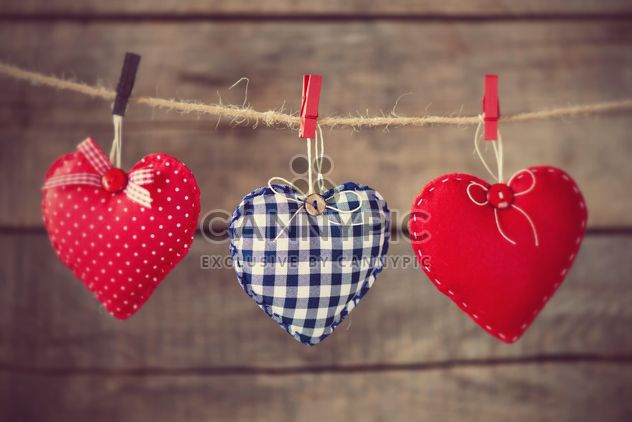 # Hearts attach to rope on wooden background - бесплатный image #271619