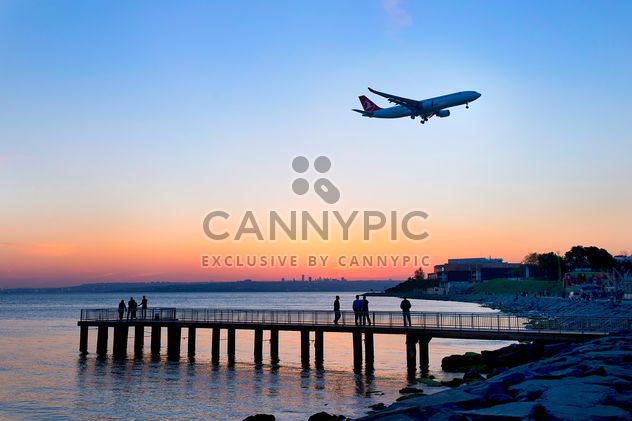 Airplane in sky and landscape on seaside - бесплатный image #272349