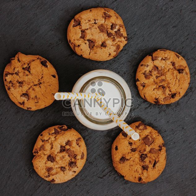 Glass of milk with chocolate chip cookies - Free image #303219