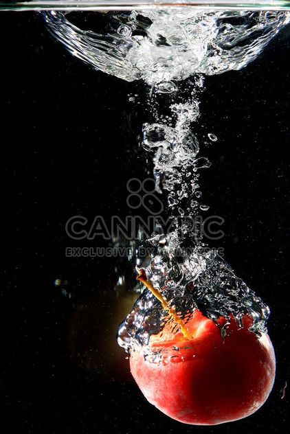 Apple falling into water - Free image #303279