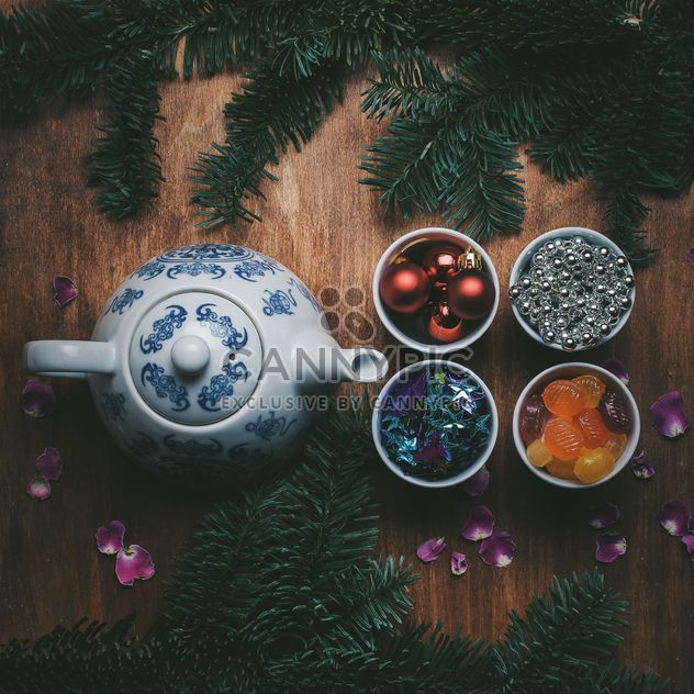 Teapot and Christmas decorations on wooden background - Kostenloses image #303949