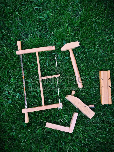 wooden toy tools on grass - image #329169 gratis