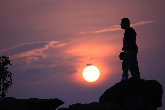 Silhouette of man at sunset - Free image #338529