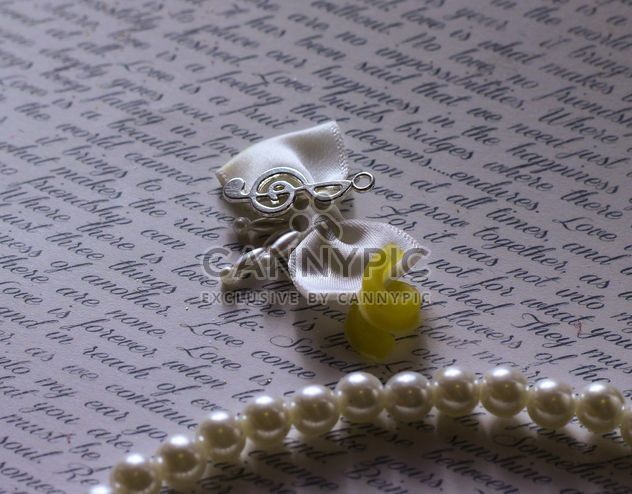 Caligraphic writing sheet with pearls and ribbon - Free image #341509