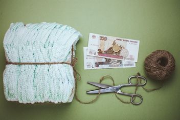 Diapers, skein of thread and scissors on green background. Diapers for 3 dollars, Cheboksary, Russia - image #342559 gratis