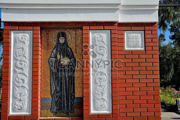 Fragment of monastery building with icon - бесплатный image #346279