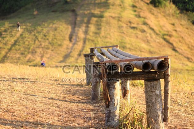 Old wooden bench in field - Free image #346609