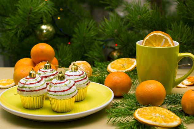 Christmas decorations in shape of cakes on plate - бесплатный image #347779