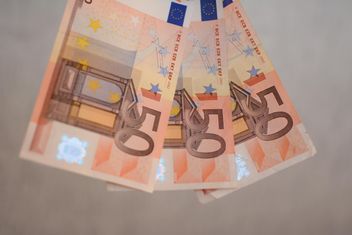Closeup of Euro banknotes on grey background - image gratuit #348419 