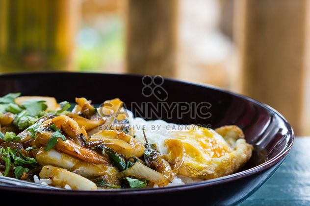 Seafood curry on rice with fried egg - Free image #439159