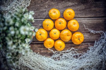 Tangerines on wooden background - Free image #452499