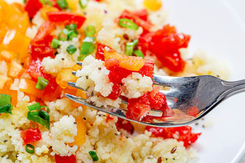Close up of cooked porridge couscous with vegetables on a fork - image gratuit #464639 