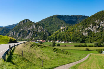 Castle on top of the hill in Swiss countryside next to the road - бесплатный image #476089