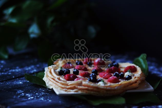 Pancakes with berries on wooden background - Free image #136459