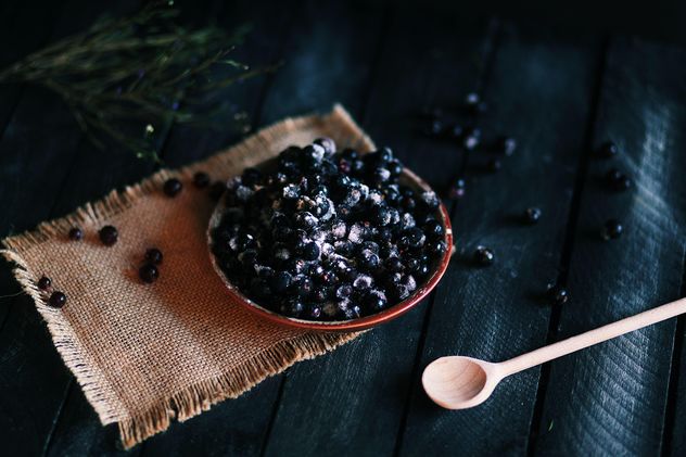 Blueberries in bowl and wooden spoon - Free image #136569