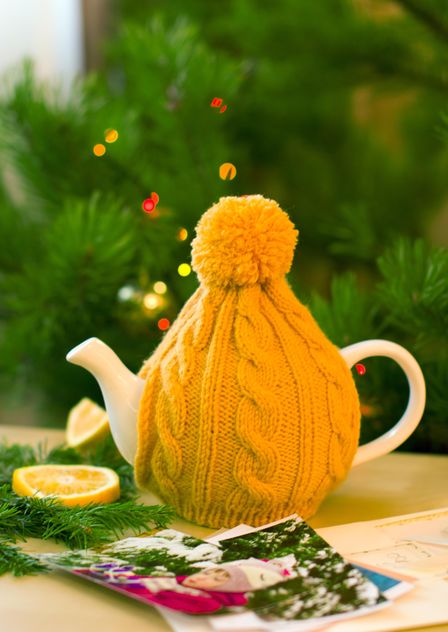 Teapot in knitted hat - image #182619 gratis