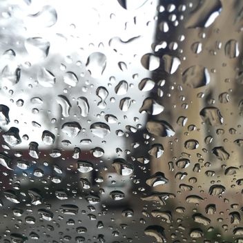 Closeup of raindrops on glass - бесплатный image #183139