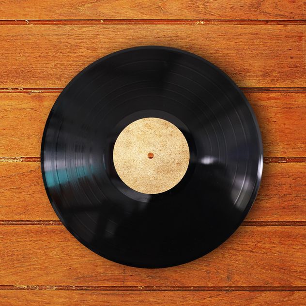 Record vinyl on wooden background - image gratuit #186979 