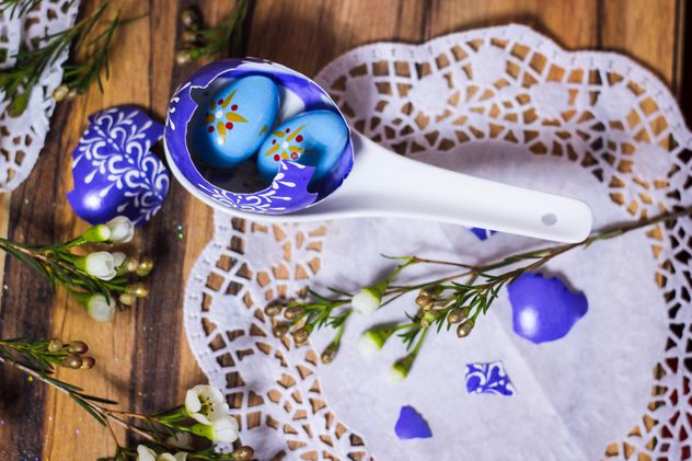 Easter eggs in spoon on wooden background - image gratuit #187489 