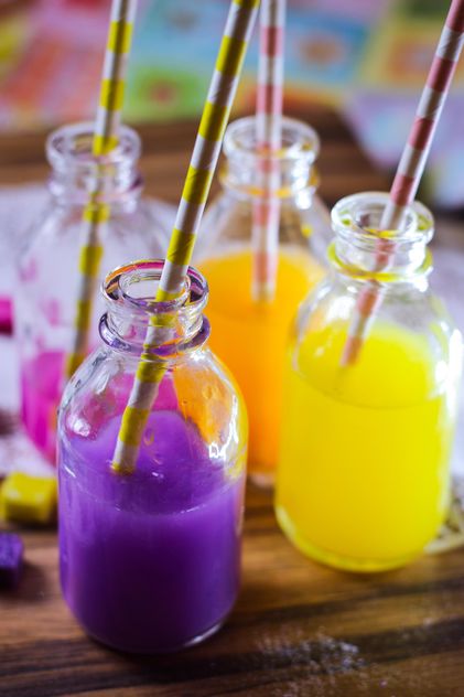 Bottles of colorful drinks - Free image #187609