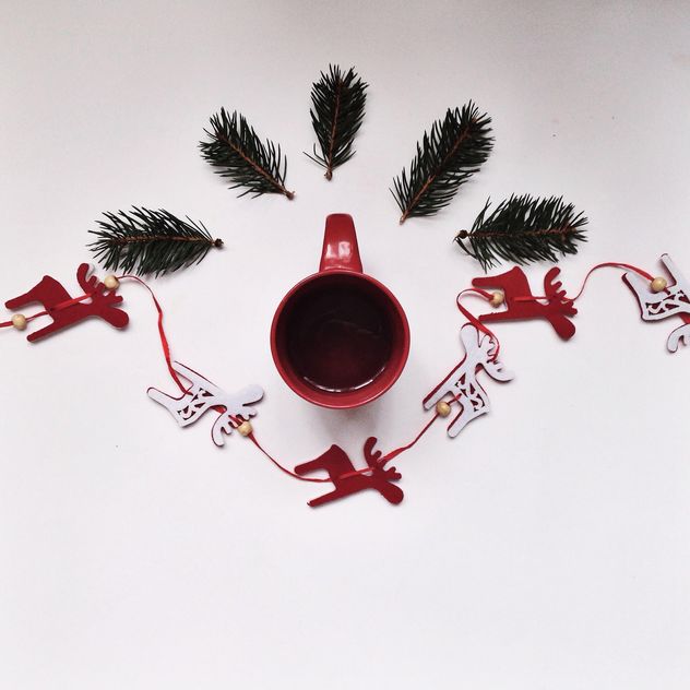 Cup of tea and Christmas decorations on white background - image #198449 gratis