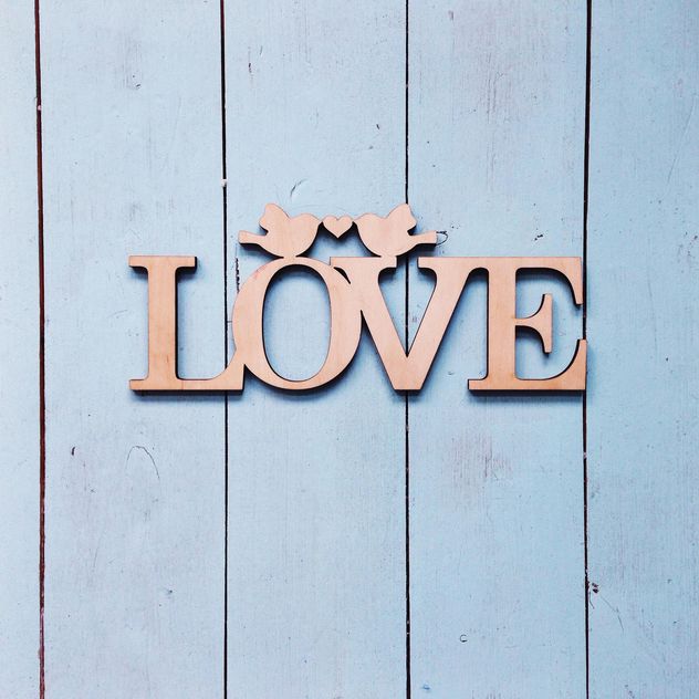 Love sign on wooden background - Free image #198479