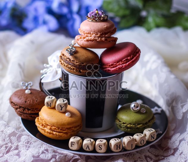Cup of tea, macaroons, small cubes and decorations - image #199049 gratis