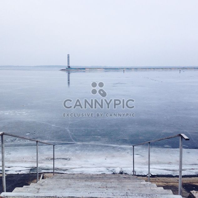 Frozen pond and lighthouse in the distance - image gratuit #273879 