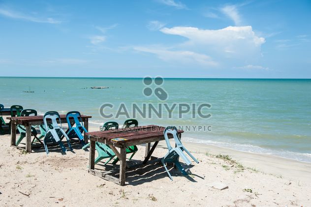 Tables and chair on beach - Free image #275089
