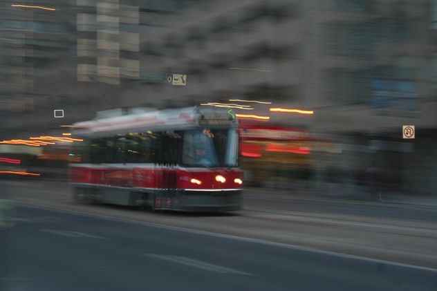Red Tram in motion in Toronto - image gratuit #305689 