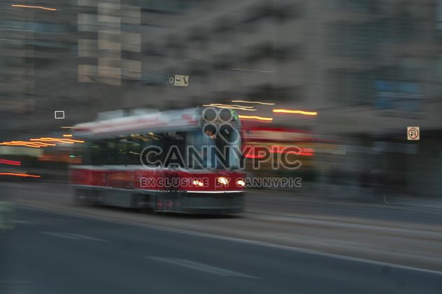 Red Tram in motion in Toronto - image gratuit #305689 
