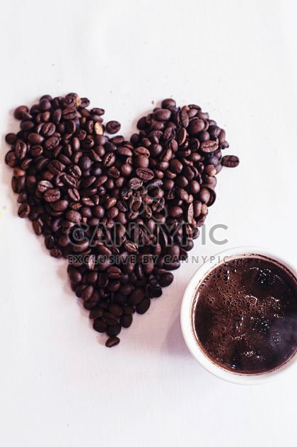 Coffee beans and cup of coffee - бесплатный image #337889