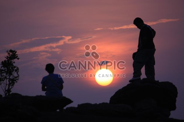 Silhouettes of people at sunset - Free image #338499