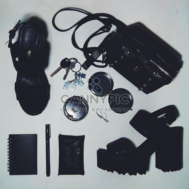 Still life with bag, purse, notebook, pen, keys, mirror, earrings, bangle, ring, shoes, chunky heels, black and white - Free image #342479