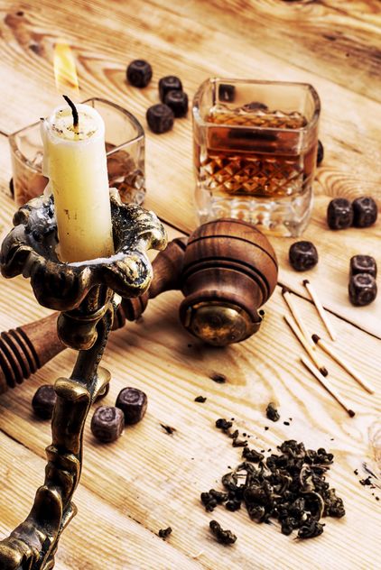 Candlestick, smoking pipe and glass of cognac on wooden background - Kostenloses image #342899