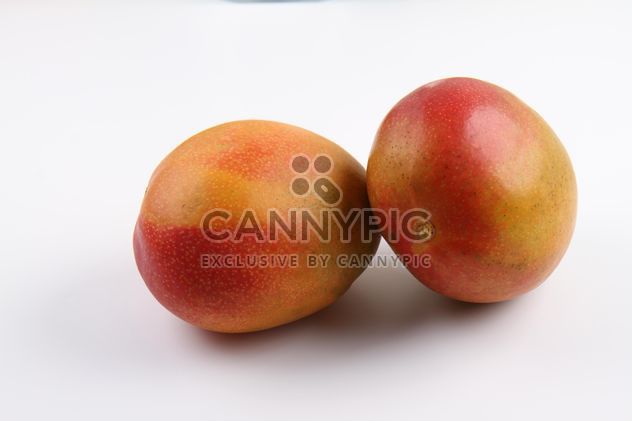 Two ripe Mangoes isolated on white - image gratuit #342909 