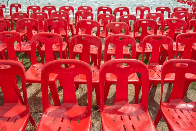 Red and white plastic chairs - Free image #344529