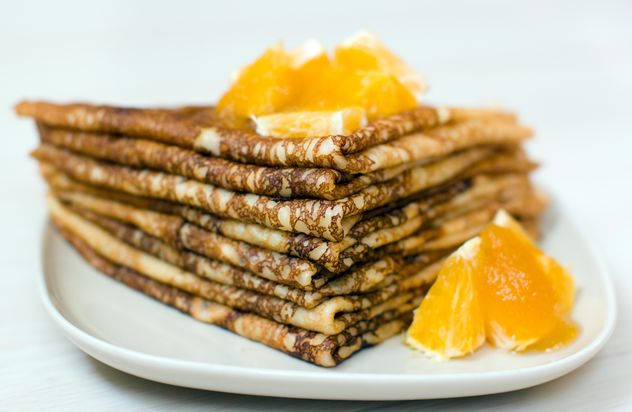 Closeup of pancakes with orange on plate - Free image #345039