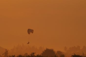 Flying paramotor in sky at sunset - Free image #347019