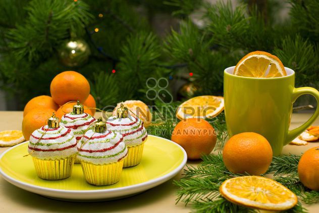 Christmas decorations in shape of cakes on plate - бесплатный image #347779