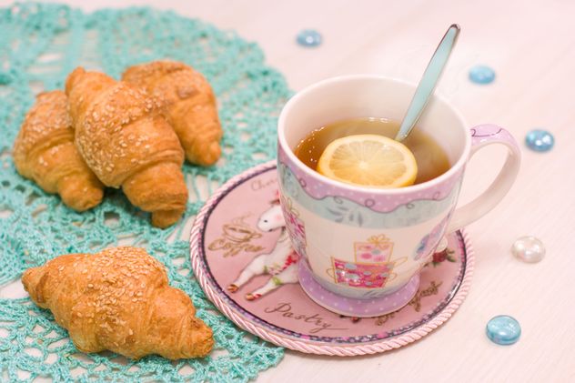 Cup of hot tea with lemon and croissants - Free image #347909