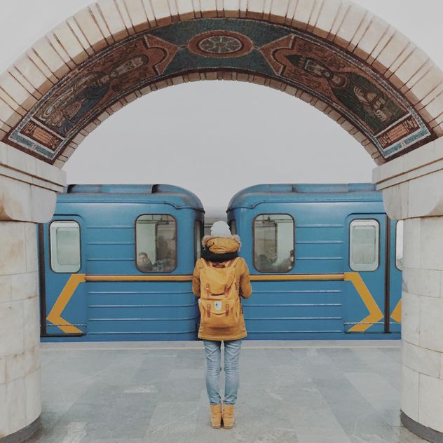 Girl standing on platform at subway station - бесплатный image #363699